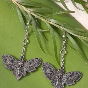 earrings featuring a death moth motif