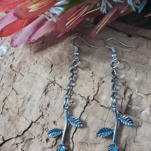 dangle earrings featuring upside down rose piece