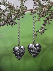 dangle earrings featuring heart shaped skull lover pieces